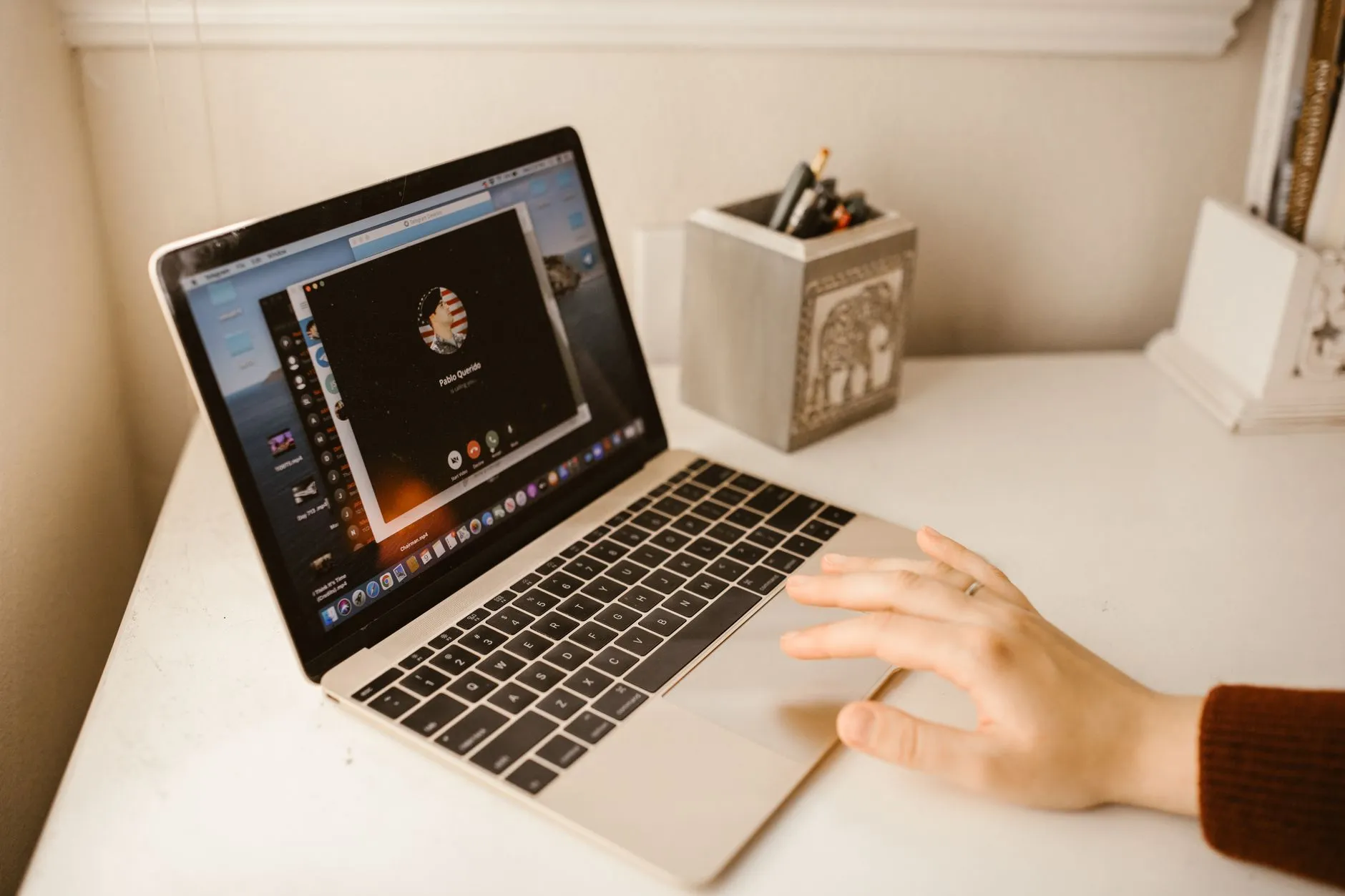 Person researching online therapy options calmly on a laptop at home