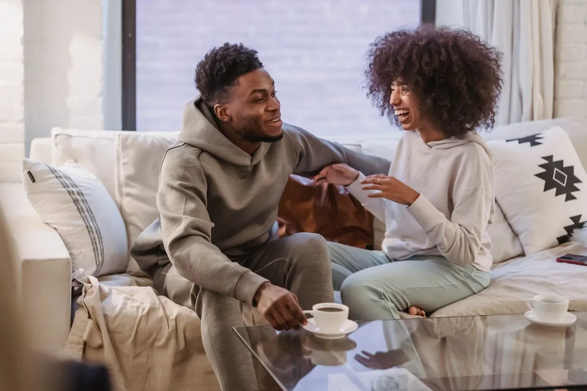 Couple talking warmly together at home