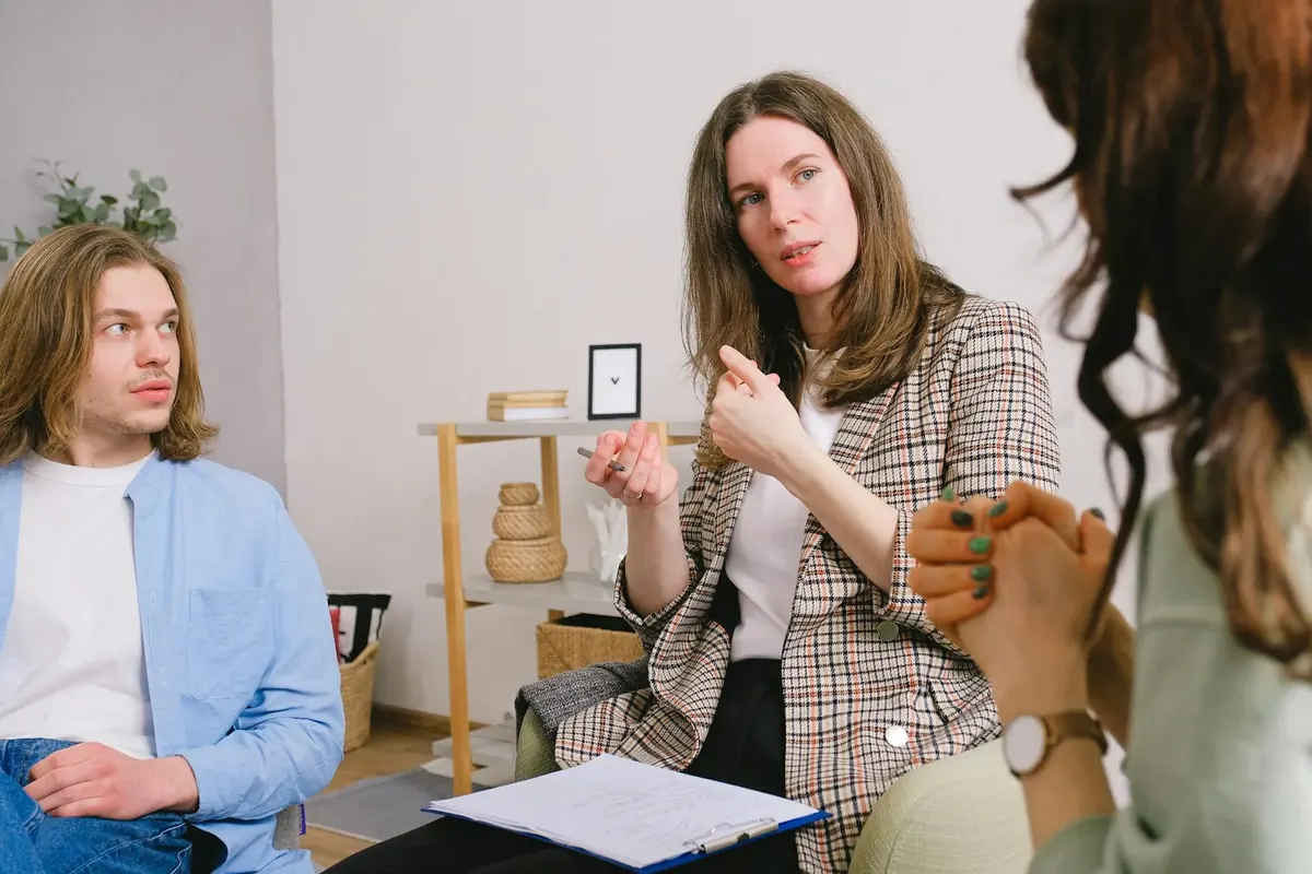 Person considering therapy options while looking at two pathways representing different mental health care choices