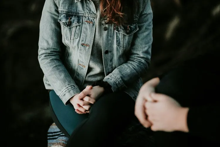 Therapist guiding a client through an online acceptance and commitment therapy session